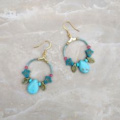 These beaded floral hoop earrings have a lovely mix of flowers, leaves, and large teardrop beads. With 18k gold-plated ear wires. Bohemian Wire Wrapped Flower Earrings, Blue Teardrop Bohemian Flower Earrings, Bohemian Blue Teardrop Flower Earrings, Blue Bohemian Teardrop Flower Earrings, Bohemian Turquoise Beaded Flower Earrings, White Howlite Jewelry, Celtic Knot Bracelet, Howlite Jewelry, Earrings Handmade Boho