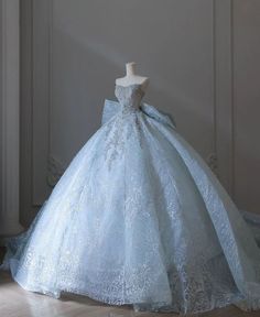 a blue ball gown on display in a room