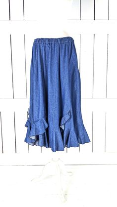 "Vintage blue ruffle flowy long denim jean skirt Measurements...taken flat -marked size: no label -across waist: 15\"-20\" -length: 33\" Features... -medium weight cotton denim -cool ruffle tiered detail -stretch waist -lovely drape and flow -unlined Condition: -excellent vintage condition -gently worn" Denim Skirt With Elastic Waistband, Relaxed Fit, Relaxed Denim Skirt With Elastic Waistband, Relaxed Fit Denim Skirt With Elastic Waistband, Casual Flare Skirt For Spring, Spring Medium Wash Skirt With Elastic Waistband, Spring Flared Cotton Skirt, Spring Denim Skirt With Elastic Waistband, Spring Tiered Denim Skirt, Flowy Flared Skirt With Ruffle Hem