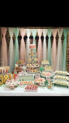 a table filled with lots of food and desserts