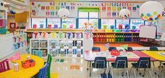 an empty classroom with tables and chairs in front of the desks is filled with toys