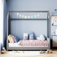 a child's bedroom with a canopy bed and blue walls