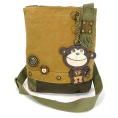 Smart Monkey Patch Crossbody Bag in Brown by Chala Brand new with tag. Size 10w in x 4d in x 10.5H inches Strap adjustable: 13-26 inches Super cute & casual this  purse includes the Monkey Key Fob! The Crossbody style is so practical too. Accented with fabricated flower & fun wood buttons. The Top Zip closure makes it easy to get into. Love  the antique brass toned hardware and fully lined interior. One interior zippered pocket Two interior slide pockets Detachable Monkey Key Fob  Material: Washed canvas cotton, leather, & textured faux leather International buyers:  Shipping and handling do not cover taxes and fees due your country destination.   We make sure that we ship the next business day of cleared payment.  Please email us for questions.  Thank you for looking! Please email me with Chala Handbag, 2024 Board, Oc Inspo, Funky Outfits, Wood Buttons, Monkey Business, Vintage Candy, Brown Bag, Canvas Gift