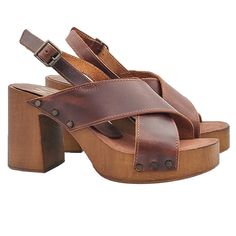 Choose the elegance and comfort of handmade women's sandals. Versatile, practical and casual, they are the must have for the summer season. Clogs in brown wood effect base Crossed bands in brown leather Padded insole in soft leather Adjustable ankle strap Heel height 8.5 cm with 2.5 cm plateau, very comfortable and elegant. Made entirely by specialized Italian personnel Handcrafted products using the best materials. BEFORE PURCHASING DO NOT FORGET TO CHECK THE SIZE! Beach Sandals With Block Heel And Deep Heel Cup, Casual Sandals With Cross Strap And Heel Loop, Casual Sandals With Heel Loop And Cross Strap, Casual Slingback Sandals With Wrapped High Heel, Casual Slingback Sandals With Wrapped Heel, Summer Cross Strap Heels With Wrapped Heel, Summer Cross Strap Heels, Summer Heels With 4-inch Heel And Cross Strap, Summer Cross Strap Heels With 4-inch Heel