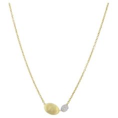 Inspired by the cobblestone streets of Seville, this iconic collection features hand-engraved "pebbles" of gold in varying sizes and lengths. A delicate chain is used to connect uniquely positioned, engraved, hammer-finished, and naturally shaped golden beads, all in 18-karat yellow gold. Shimmering, precious pavé diamonds enhance the glimmering beads of the Siviglia Collection. Gold And Diamond Pendant, Golden Beads, Cobblestone Streets, Marco Bicego, Delicate Chain, Seville, Hand Engraving, Pave Diamonds, Diamond Pendant