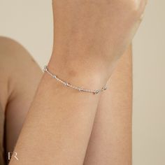 "925 solid sterling silver ball bracelet. A minimalist design with a sophisticated look. Pairs well with any outfit and is suitable for everyday wear or for all special occasions. Crafted with 925 Sterling Silver, is adjustable hand polished to a mirror shine. A beautiful bracelet that the bridesmaids, brides or special women in your life will adore. Wear alone or stack alongside your other favorite bracelets.  The perfect bracelet gift for any occasion such as anniversary, birthday, engagement, Adjustable Silver Chain Minimalist Bracelet, Adjustable Sterling Silver Chain Bracelet Minimalist Style, Minimalist Sterling Silver Bracelet With Adjustable Chain, Minimalist Silver Resizable Bracelet, Minimalist Adjustable Sterling Silver Bracelet, Tarnish Resistant, Minimalist Bracelet Silver, Ball Bracelet, Minimalist Bracelet, Layered Bracelets