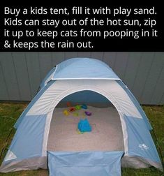 a blue and white tent sitting in the grass