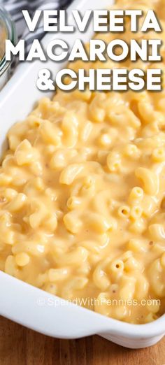 a close up of macaroni and cheese in a white casserole dish