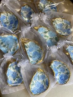 blue and white decorated cookies in plastic bags