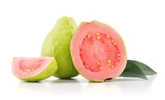 a cut in half watermelon with leaves on the side