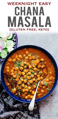 a blue bowl filled with chickpeas and garbana masala next to cucumbers