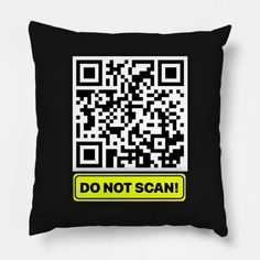 a black pillow with a yellow don't scan sticker on the front and back