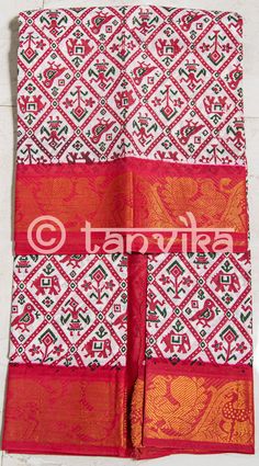 Here's a unique Madurai Sungudi Saree featuring Patola inspired prints all over the body and contrast border with peacock patterns in zari. Border Zari patterns will be exactly same as in pictures. Simple, sober, earthy, these sarees are light weight, pure cotton, airy, versatile, comfortable to drape and wear, colorful. The print might have slight irregularities in the pattern & colors and the edges may not be perfectly straight which results from the human involvement in the dip dyeing pro Festival Puja Sets With Border Detail, Sets With Border For Puja And Festivals, Festive Sets With Border For Puja, Ikat Print Sets For Navratri Puja, Navratri Ikat Print Sets For Puja, Ikat Print Sets For Puja And Navratri, Traditional Wear With Printed Border For Puja And Navratri, White Traditional Ikat Print Dupatta, Traditional White Ikat Print Dupatta