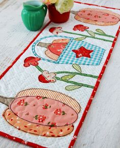 a table runner with an image of a bowl of food on it and flowers in the background