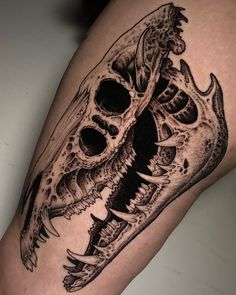 a black and white image of a skull on the leg