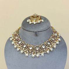 A pair of Sana Kundan Necklace Set – White for Shaadi. Size & Other Details Material: Kundan Stone, Pearls Attire: Lehenga, Salwar Suit, Kurti, Saree, Flared Dress, Gown Earrings Length: 5.5cm Earrings Weight: 11gm/pc White Meenakari Jewelry For Party, White Jewelry Sets With Latkans, White Latkans Necklace For Wedding, White Wedding Necklaces With Latkans, White Stone Work Necklaces For Party, White Necklace With Latkans For Party, White Necklaces With Latkans For Parties, Party White Necklace With Latkans, White Necklace For Party And Festivals