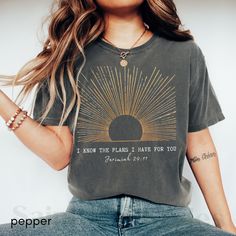 Shine bright with our Boho Christian Shirt! This sunshine T-shirt is a daily prayer reminder and makes a perfect gift. Featuring Jesus Christ designs, this Christian merch combines faith streetwear with vintage worship vibes. Wear your love for Jesus and conversation starter Bible verse T-shirt for inspirational style. **Note: FOR A RELAXED FIT, CHOOSE YOUR GO-TO SIZE. TO ACHIEVE AN OVERSIZED, LOOSE FIT, WE RECOMMEND GOING UP AT LEAST 1-2 SIZES. MODELS IN PHOTOS ARE WEARING 1-2 SIZES LARGER THAN Inspirational Graphic Print T-shirt For Everyday, Inspirational Everyday T-shirt With Graphic Print, Inspirational Graphic Print Tops For Everyday, Inspirational Letter Print Tops For Everyday, Inspirational Screen Print Crew Neck Top, Inspirational Short Sleeve Tops For Everyday, Inspirational Short Sleeve Everyday Tops, Inspirational Crew Neck Soft-washed T-shirt, Inspirational Soft-washed Crew Neck T-shirt