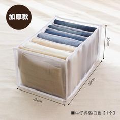 an open drawer with five pants in it and measurements for the bottom section on top