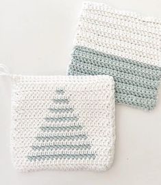 two crocheted coasters sitting next to each other