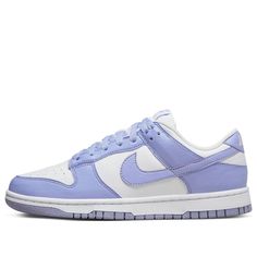 Take a step back in time while freeing the environment from some of its human-caused burden with the Nike Dunk Low Next Nature Lilac Women. Crafted with 20% recycled materials, these eye-catching shoes provide an inspiring take on retro style. The upper is designed using white leather and punctuated with perforated toe box for added breathability. Violet hues appear throughout, tinting the overlays and laces as well as adding a subtly branded touch via a purple Nike label on the tongue. To complete the look, the heel has an embroidered white Nike logo and volt insole sets off a black pinwheel against the white rubber midsole. This eco-friendly masterpiece comes together with a stunning purple Grind outsole—an inimitable combination of athletic style and sustainable design. With fashion tre Nike Dunk Low Next Nature, Preppy Shoes, Purple Nikes, Cute Nike Shoes, Purple Shoes, Cute Nikes, July 2022, Swag Shoes, A Bathing Ape