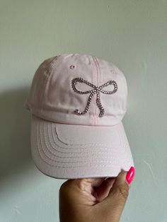 Pink adjustable hat with rhinestone bow Adjustable Rhinestone Baseball Cap With Curved Brim, Casual Rhinestone Cap, Casual Cap With Rhinestones, Casual Adjustable Baseball Cap With Rhinestones, Casual Rhinestone Snapback Hat, Adjustable Rhinestone Cap, Adjustable Baseball Cap With Curved Brim For Party, Rhinestone Bow, Baseball Hat