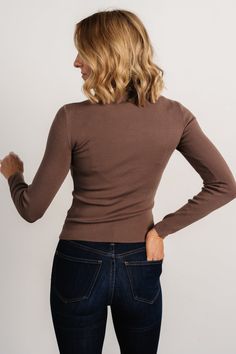 Baltic Born exclusive style Must-have closet staple Solid mocha brown color Soft, lightweight knit material with good stretch Mock turtleneck Snug to body fit 50% Viscose, 28% Polyester, 22% Nylon Trina is 5'6, cup size 32D, size 2 and is wearing size S Stretch Fine Knit Brown Sweater, Stretch Brown Fine Knit Sweater, Brown Stretch Turtleneck Tops, Brown Turtleneck Sweater For Work, Brown Long Sleeve Turtleneck For Work, Winter Brown Stretch Turtleneck, Fitted Brown Long Sleeve Turtleneck, Fitted Brown Turtleneck With Long Sleeves, Brown Knit Top For Layering