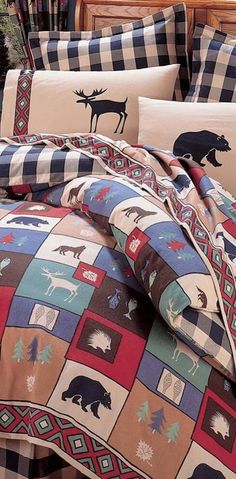 the comforter is made up with moose and trees on it