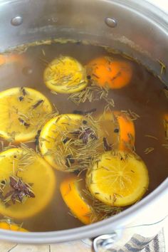 a pot filled with water and lemon slices