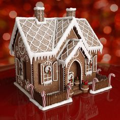 a gingerbread house with candy canes and candies