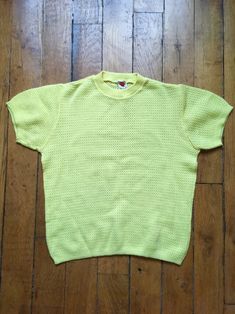 "This is a sweet wool mix sweater in a lovely lemon yellow shade.  Hails from the 1960s and has a distinctly Grease feel about it ! Very suitable for those summer nights.  Sourced in Paris and was part of a Prada designer's Archive.  Size - fits well like a UK size 10 - 12 , chest - 40\" ; length - 22.5\" ; sleeve length - 7.5\"" Retro Yellow Crew Neck Sweater, Retro Textured Knit Top, Yellow Textured Knit Crew Neck Sweater, Yellow Textured Knit Crew Neck Top, Retro Textured Knit Crew Neck Top, Yellow Cotton Summer Sweater, Mustard Knit Crew Neck Top, Yellow Knit Sweater For Spring, Yellow Vintage Crew Neck Top