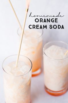 two glasses filled with orange cream soda