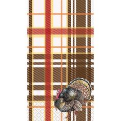 a turkey standing on top of a plaid tablecloth with an orange and brown background