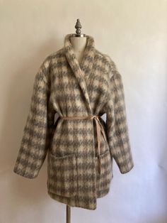 1980s Wayne Stuart mohair large herringbone print cocoon style coat with two large patch pockets and shawl collar has no closures; to be worn open, or create your style with a belt or snaps. Fully lined in acetate, in excellent vintage condition. Shoulders 22" across Chest 50"(25" across, doubled) Waist 48" Hem 52" Arm length from neck to cuff 29", from shoulder to cuff 21.5" Length from back of neck to hem 34" Style Coat, Oversized Coat, Shawl Collar, Herringbone, Jackets For Women, Jackets & Coats, Collar, Clothes For Women, Grey