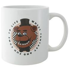 a white coffee mug with a brown bear wearing a top hat and checkered design