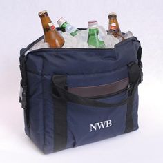 a cooler bag filled with beer bottles on top of a table