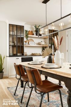 a dining room table with chairs around it