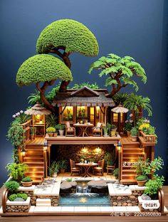 a miniature house with trees and plants on the roof