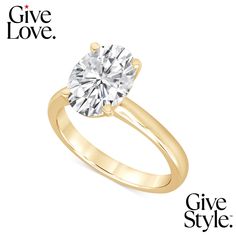 a yellow gold engagement ring with a round cut diamond in the center and give love