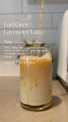 a jar filled with liquid sitting on top of a counter