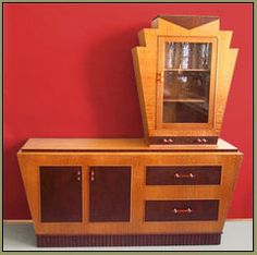 a wooden cabinet with a mirror on top