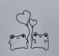 a drawing of two cats holding balloons in the shape of heart shaped shapes on paper