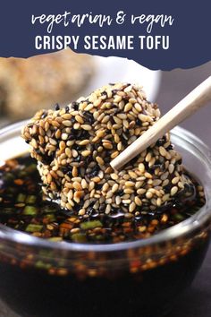 sesame seed balls in a glass bowl with a wooden spoon on top and text overlay reading vegetarian & vegan crispy sesame tofu