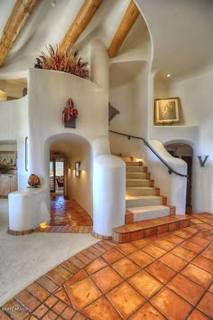 an entry way with stairs leading up to the second floor