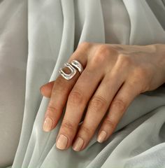 -Material: Silver, Stainless Steel Discover the exquisite elegance of our Stainless Steel Ring, a meticulously crafted piece that effortlessly embodies timeless sophistication. Handmade with precision, this Wrap Ring showcases an abstract geometric design, creating a captivating allure that seamlessly blends modern aesthetics with classic charm. -Abstract Geometric Design- The ring boasts a unique and eye-catching geometric pattern, adding a touch of contemporary artistry to your ensemble. -Chun Fimo Ring, Ring Wrap, Polymer Clay Ring, Silver Wrap Ring, Zierlicher Ring, Chunky Ring, Wide Ring, Trendy Ring, Wrap Ring