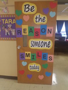 a bulletin board that says be the reason someone smiles today