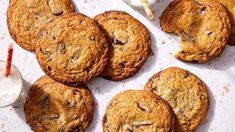 chocolate chip cookies and milk on a table