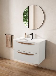 a bathroom with a sink, mirror and towel rack on the wall next to it