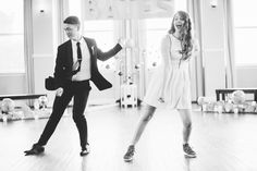 two young people are dancing on the dance floor