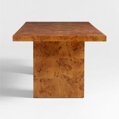 a wooden table that is made out of wood and has a square shape on the top