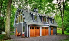 a two car garage in the middle of a wooded area